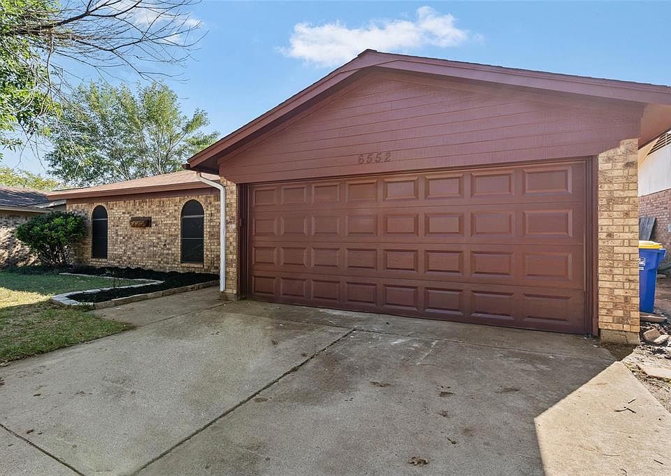 Single story home with a garage