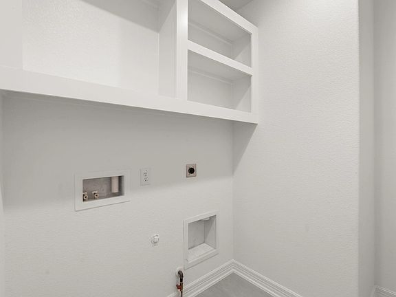 Utility room. Note Sample product photo - actual exterior and interior selections may vary by homes