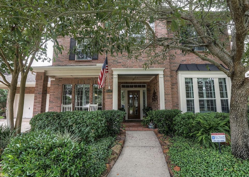Beautiful canopy of trees provides shade and wonderful curb appeal.