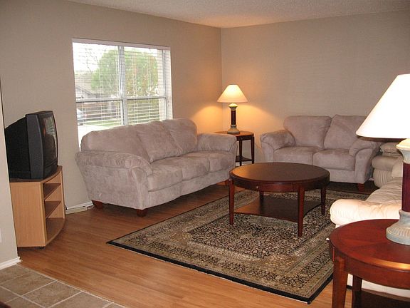 sitting area - pergo floors, new paint