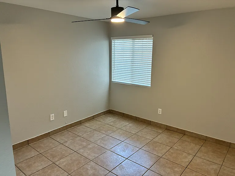 3rd bedroom with window and brand new ceiling fan with remote