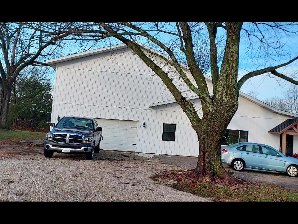 Front of home, Apt above garage area, Entrance to apt thru garage coded lock door