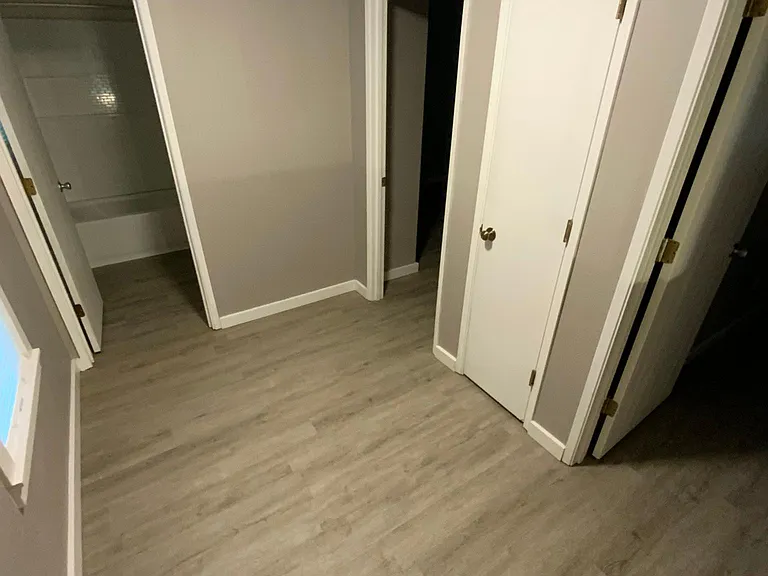 Landing at the top if the stairs that enters to the bathroom & both bedrooms