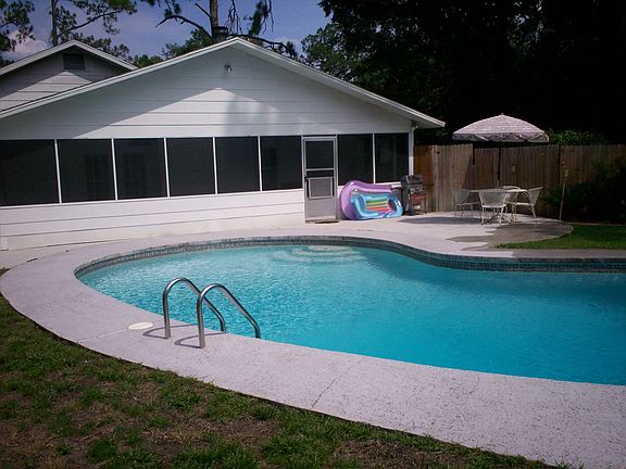 Screened porch with large pool