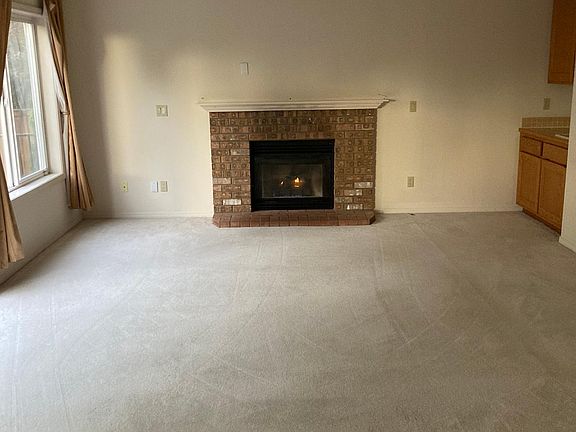 Living room with fireplace & wet bar
