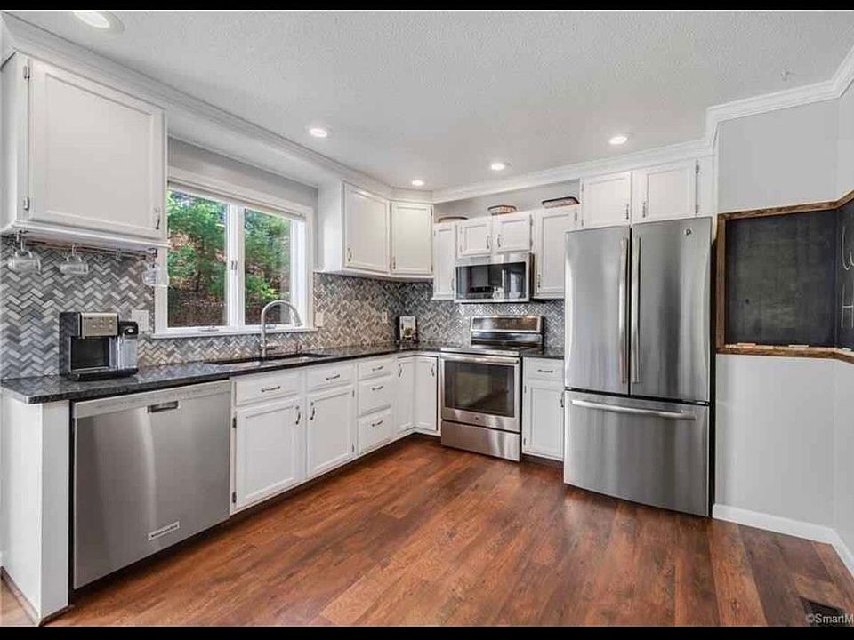 Beautifully updated eat-in kitchen with newer stainless appliances.