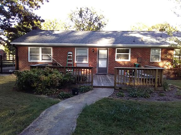 Back of House - Sidewalk leads to Carport with Ally Access