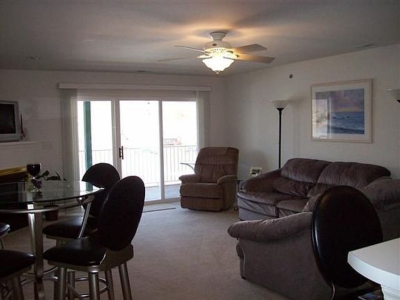 Another View of Living Area, sliders to covered, screened deck