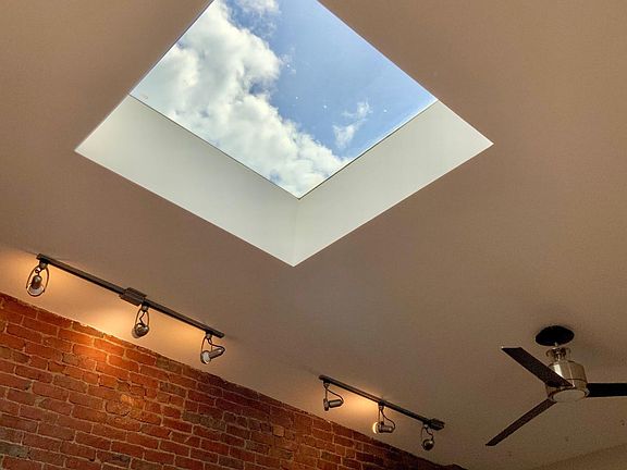 Large 42" x 42" skylight in center of living room.