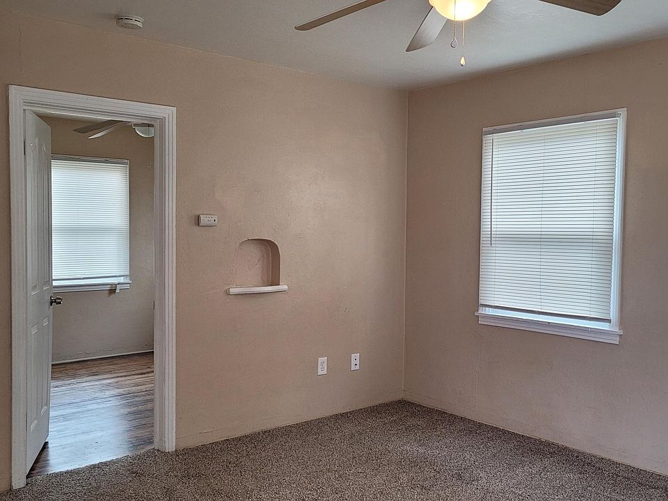 Living room with view into Bedroom 1