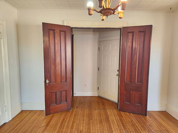 Bedroom 1 - double doors lead into the hallway