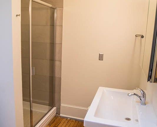 Bathrooms have large marble walk-in showers