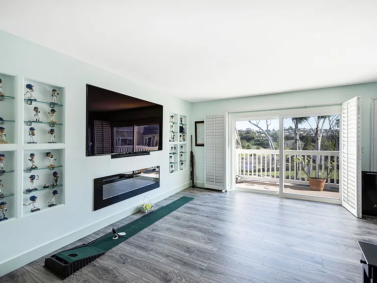 Living room has an electric fireplace