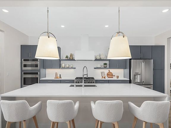 Kitchen with quartz island and countertops
