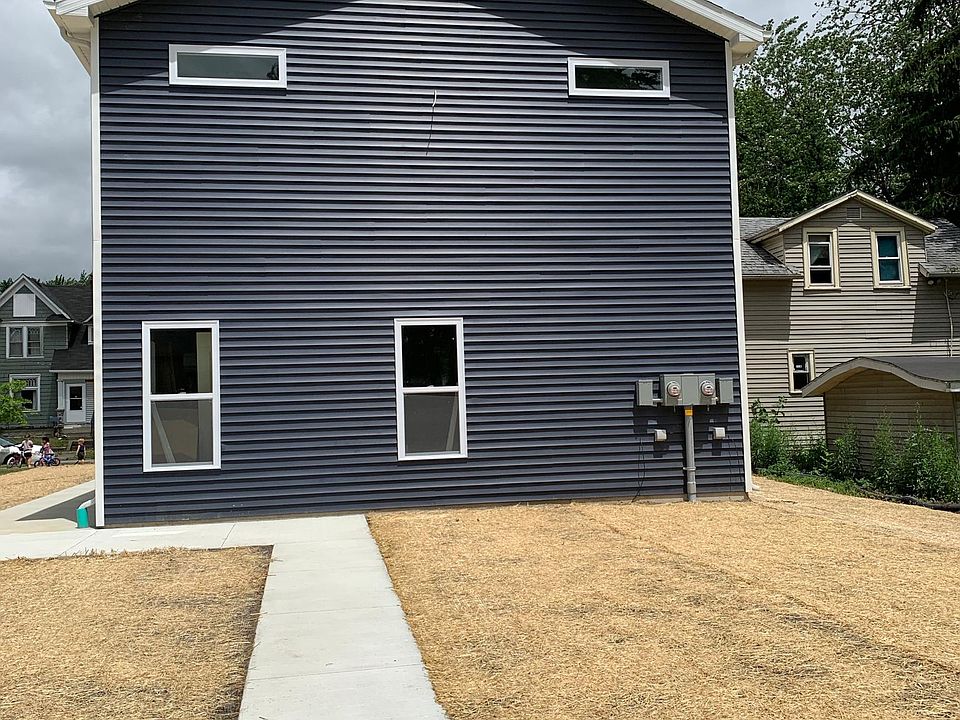 Exterior - backside near parking spaces