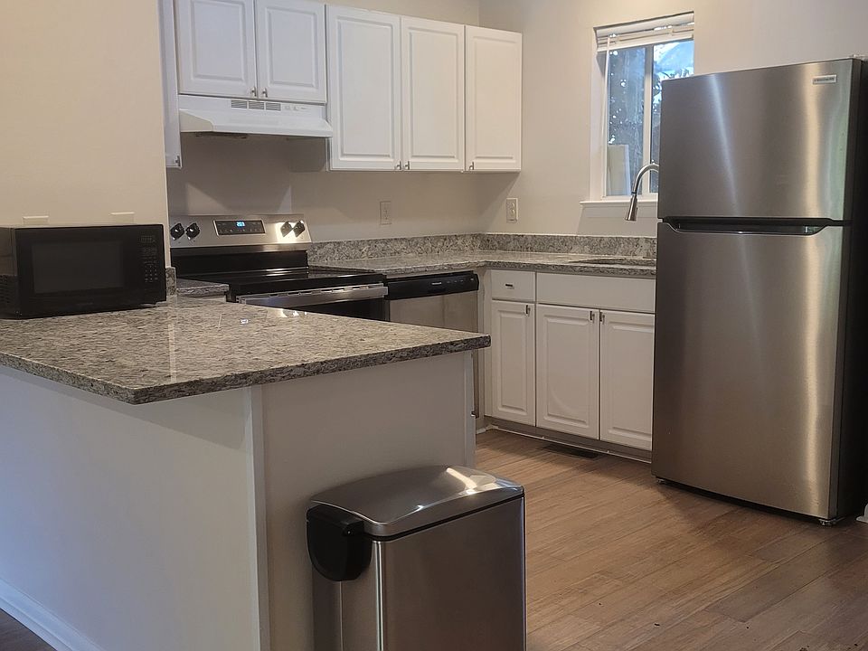 Full-size shared kitchen with new appliances, pantry and coat closet.