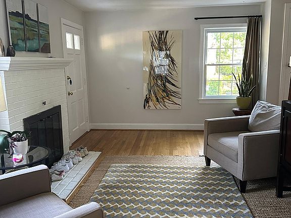 Living room with working wood-burning fireplace