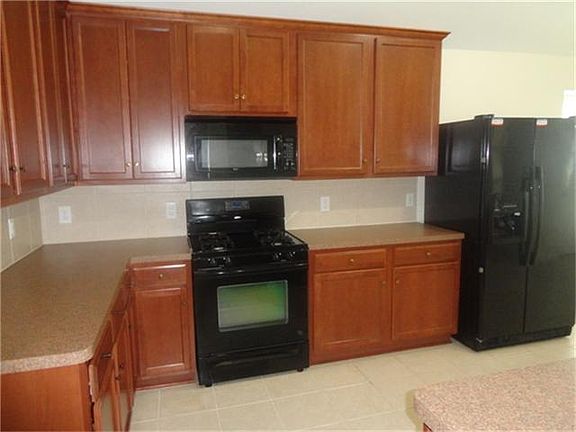 Large kitchen with tile floor