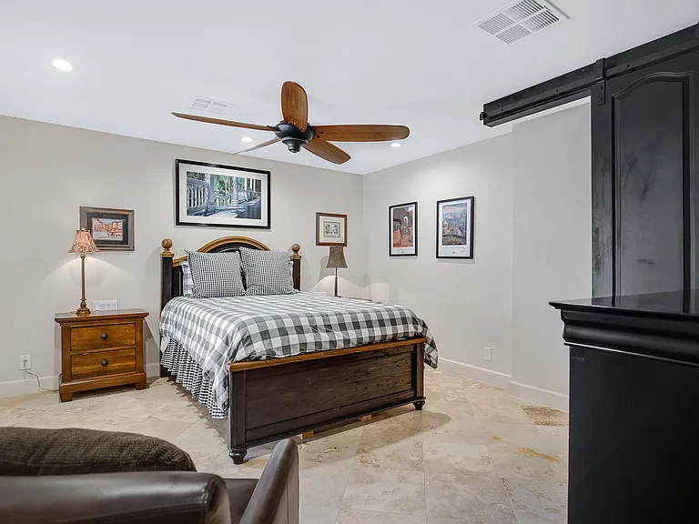 Private bedroom with access to front courtyard.