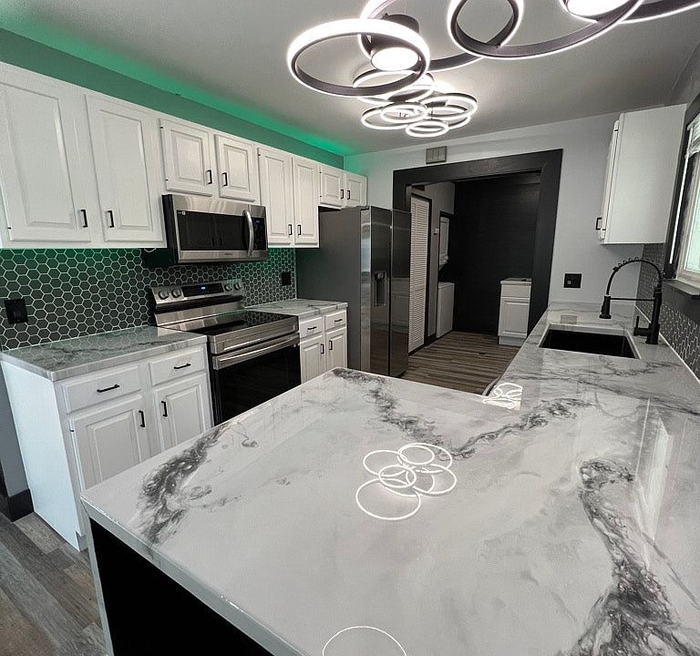 Brand new cabinets, appliances, backsplash, countertops, sink , faucets, and wine cooler