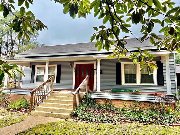 Front view - there are hooks for you to add your porch swing! Porch deck boards and posts are set to be replaced by occupancy.