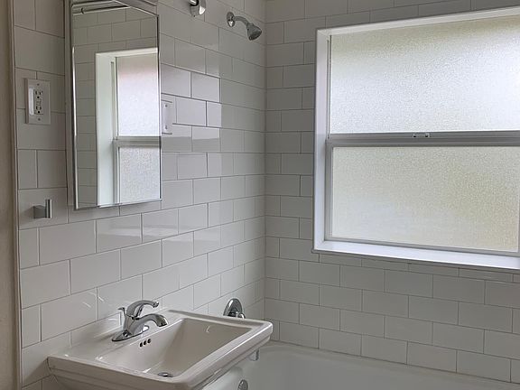 Newly remodeled bathroom with spa window for great natural light