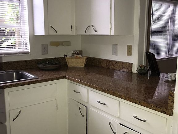 well lit kitchen and separate dining area