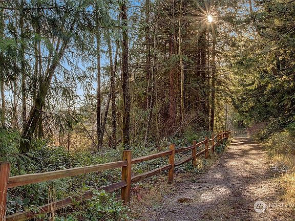 This is the trail to the Lake 16 Community Dock. Disclaimer: Renderings, photos, floor plans, prices, and all content, including all verbiage, is not contractual and is subject to change at any time. Call Bruce Lystad for details.>