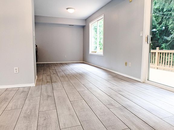 Dining area with sliding door to backyard + patio