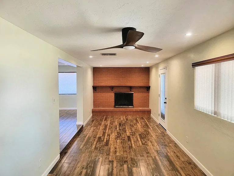 Wood Burning Fireplace in Den, off of the Living Room