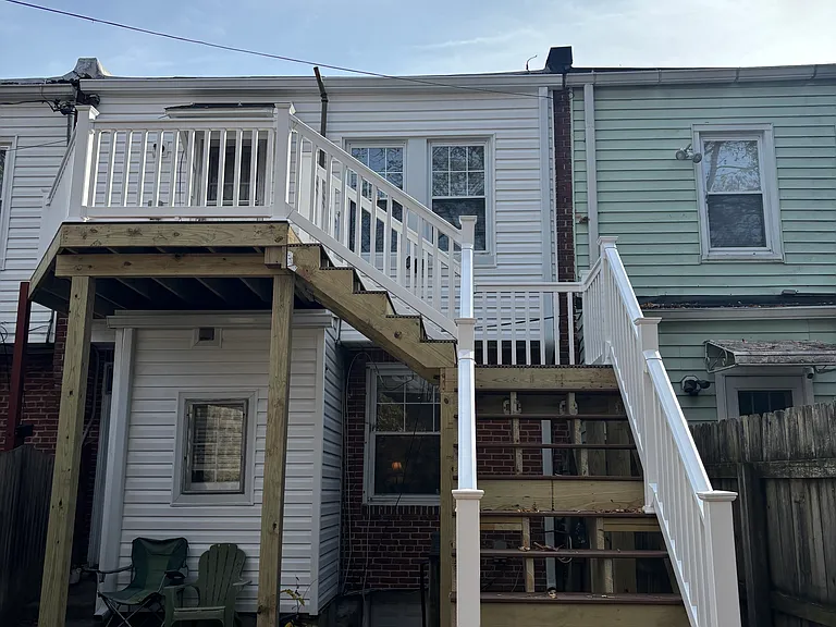 New rear deck up to kitchen door of #2