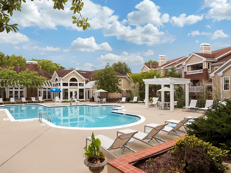 Swimming pool and sundeck with lounge seating