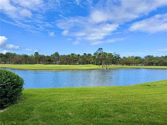 STUNNING expansive lake & golf course to enjoy from Living Room & Primary Bedroom!
