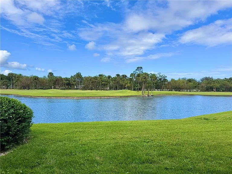 STUNNING expansive lake & golf course to enjoy from Living Room & Primary Bedroom!