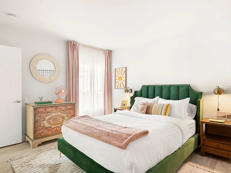 Guest room with queen size bed, dresser and large closet.