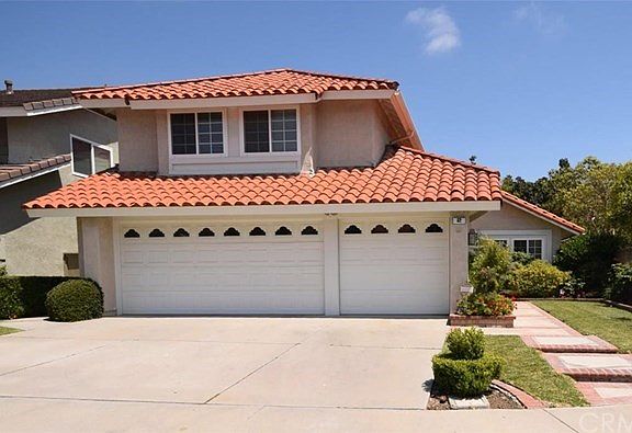 Beautiful front yard with brick accent.