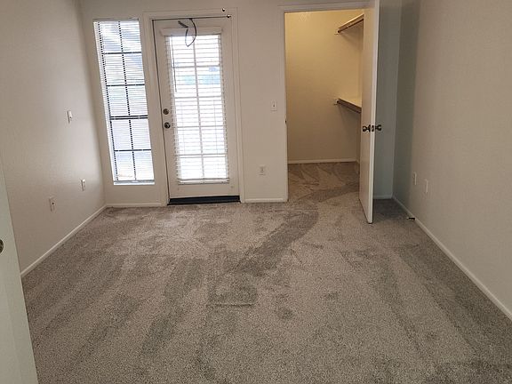 Master Bedroom with Walk In Closet and access to Patio.