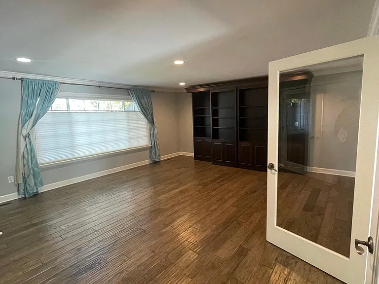 Large Bonus room has built-in Murphy bed, makes a great office! Perfect headquarters for working from home. Large window with plenty of natural light. Largest room in the house.