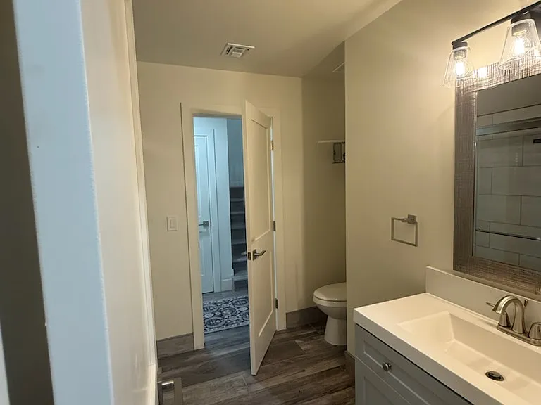 One of the 2 bedrooms upstairs can use this bathroom or perfect for front office/front 5th bedroom use. Opens on both sides for more utility.