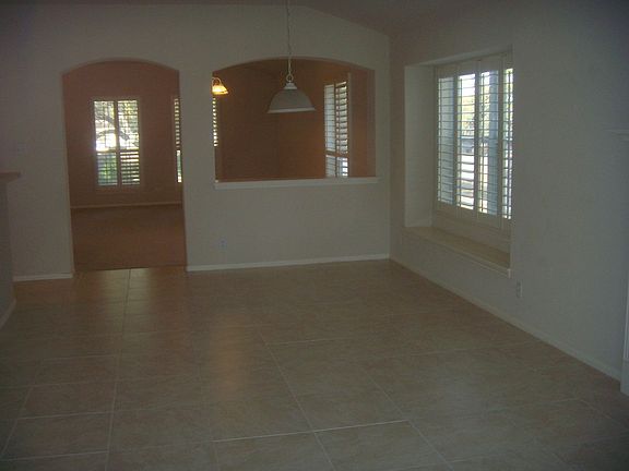 Rounded doorways and plantation shutters give this home an elegant warmth!