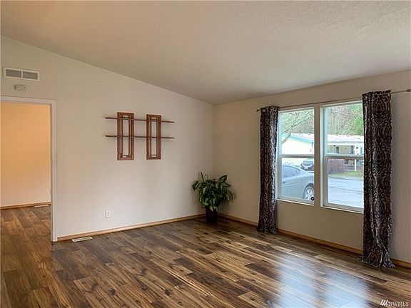 Another view of living room (view of master room included in photo)