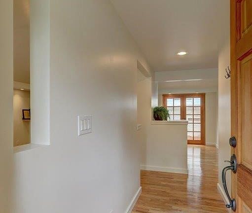Entry through the front door on the main level.  Hardwood floors throughout the main level. 
