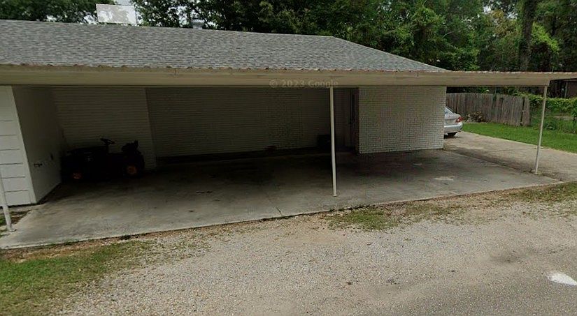 Front door entry to the apartment is under the carport.