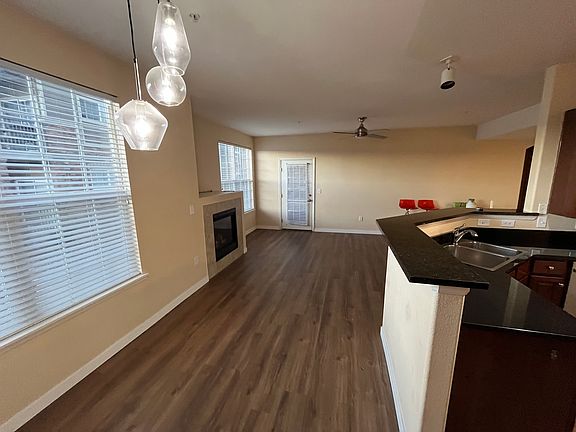 Open floor plan connects kitchen, dinning, and living room