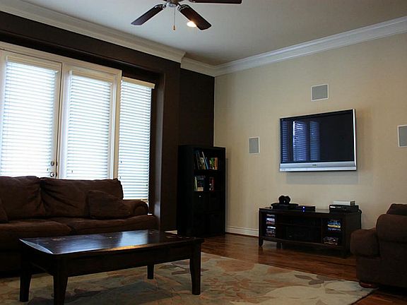 View of the living from the dining. There is a juliet balcony that allows the doors to open up on a 