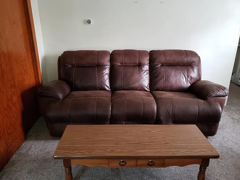 Leather couch , loveseat and coffee table