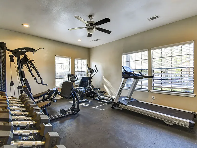 Bright and spacious fitness area with treadmills and cycling equipment to keep your workouts on track.