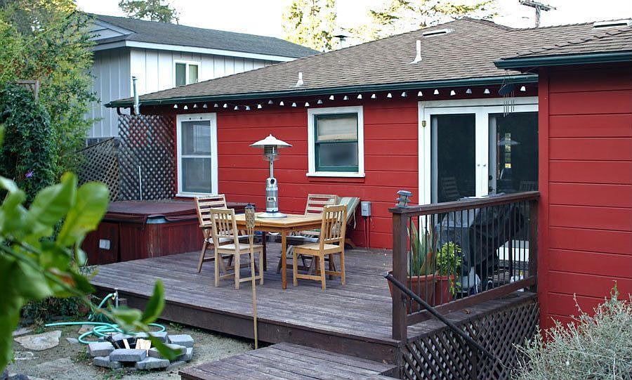 Back deck opens up to numerous fruit trees and vegetable gardens