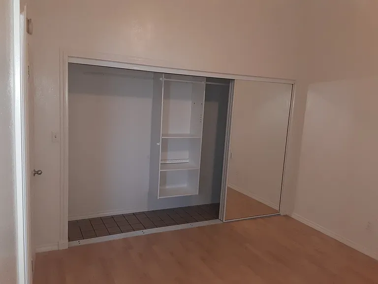 Master bedroom, large closet with 3 rolling mirror doors.