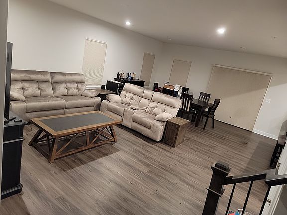 'Great room' used as a living room and dining room. Dining room view.